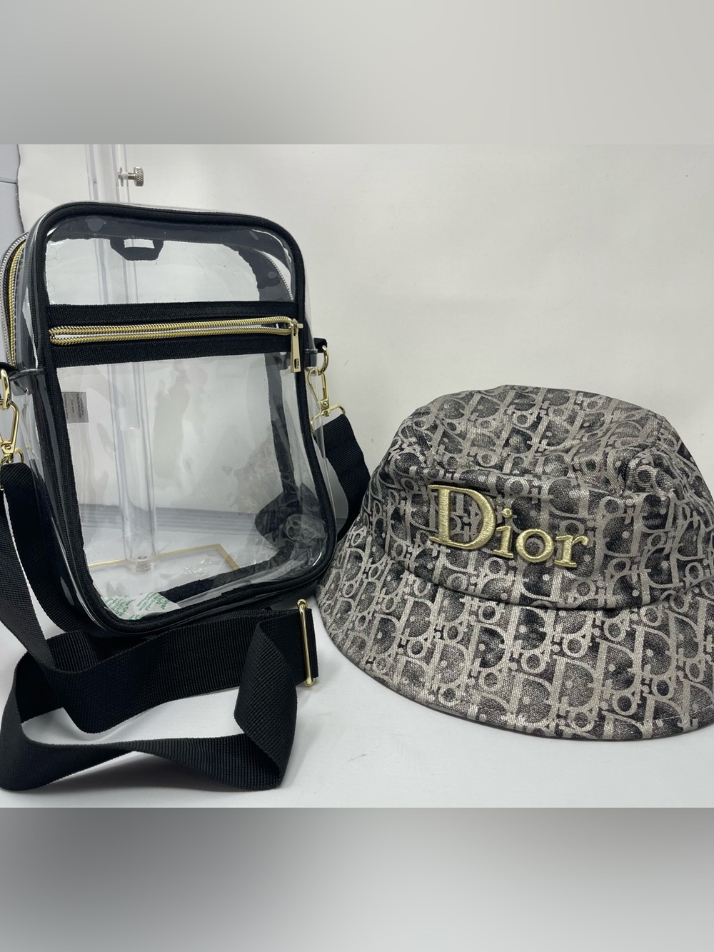 Fashion monogram bucket hat with gold and metallic gray accents & Clear bag